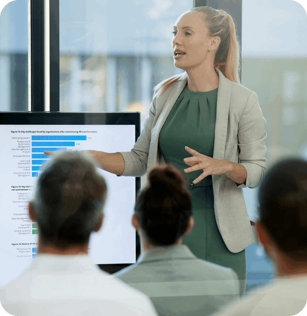 Woman giving presentation to seated audience.